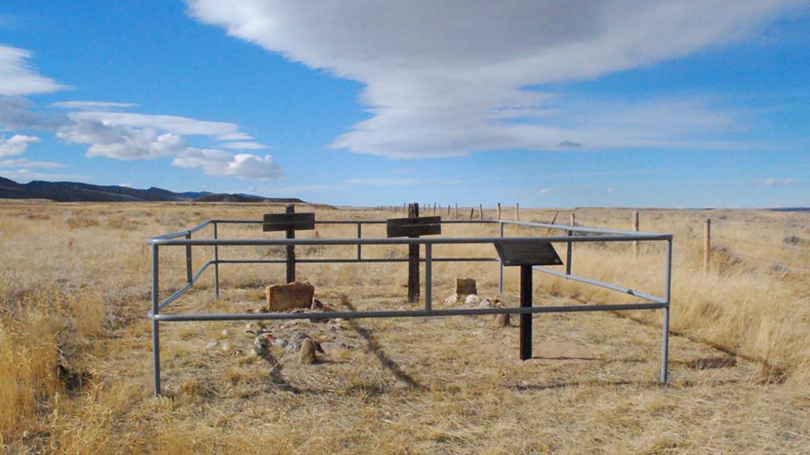 Graves of the victims of the 1864 attack on the Kelly-Larimer wagon train. William Larimer, the Rev. Andrew Sharp, Noah Taylor and Franklin Sullivan are buried in a single grave on the left; Little Mary Kelly, as she was known in contemporary accounts, is buried in the right-hand grave.