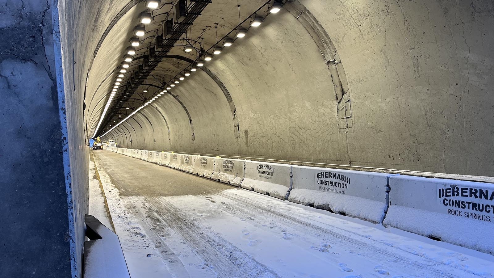 The eastbound lane of Interstate 80 through the Green River Tunnel is being prepared to handle two-way traffic with concrete barriers.