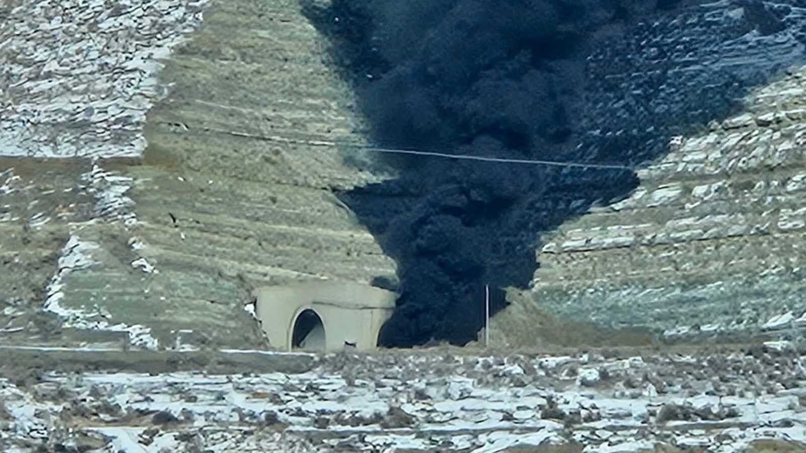 Heavy, black smoke continues to billow out of both ends of the Green River tunnels along Interstate 80 after a fatal multivehicle pileup and fire inside Friday afternoon. People in traffic report “huge explosions.”