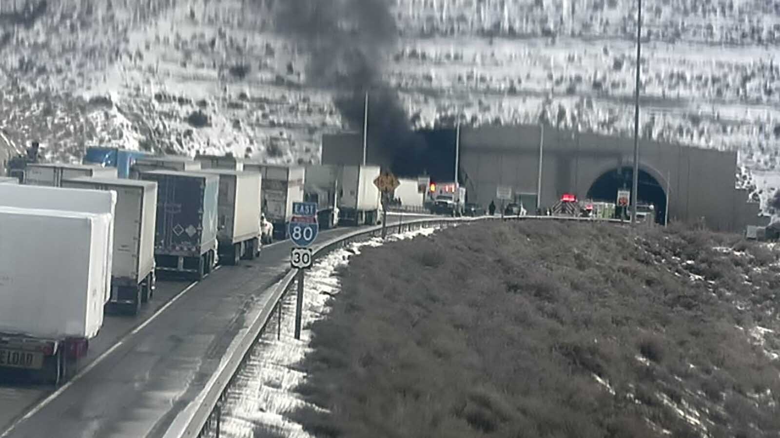 Heavy, black smoke continues to billow out of both ends of the Green River tunnels along Interstate 80 after a fatal multivehicle pileup and fire inside Friday afternoon. People in traffic report “huge explosions.”