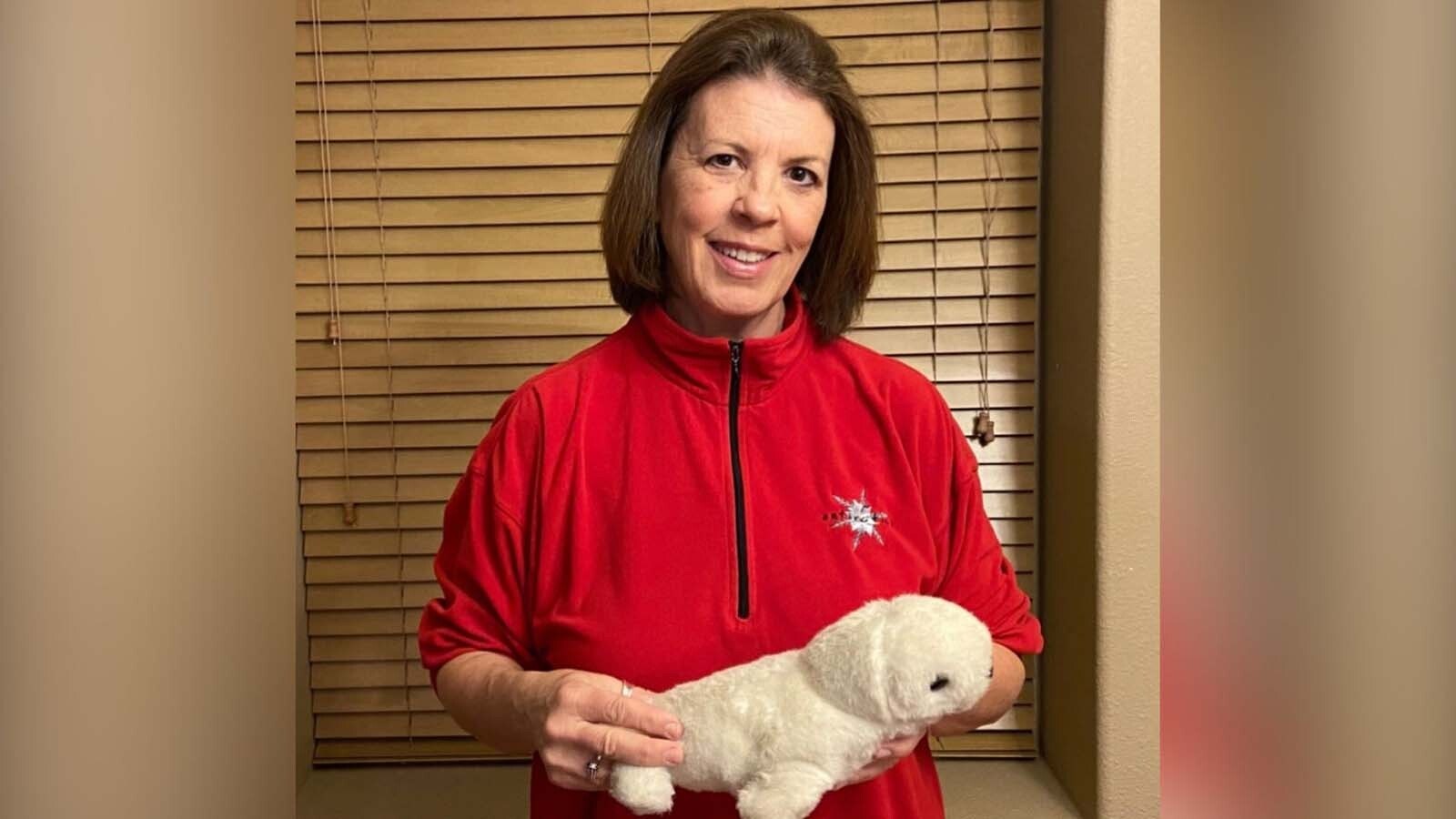 Deanna Werner with a stuffed seal.