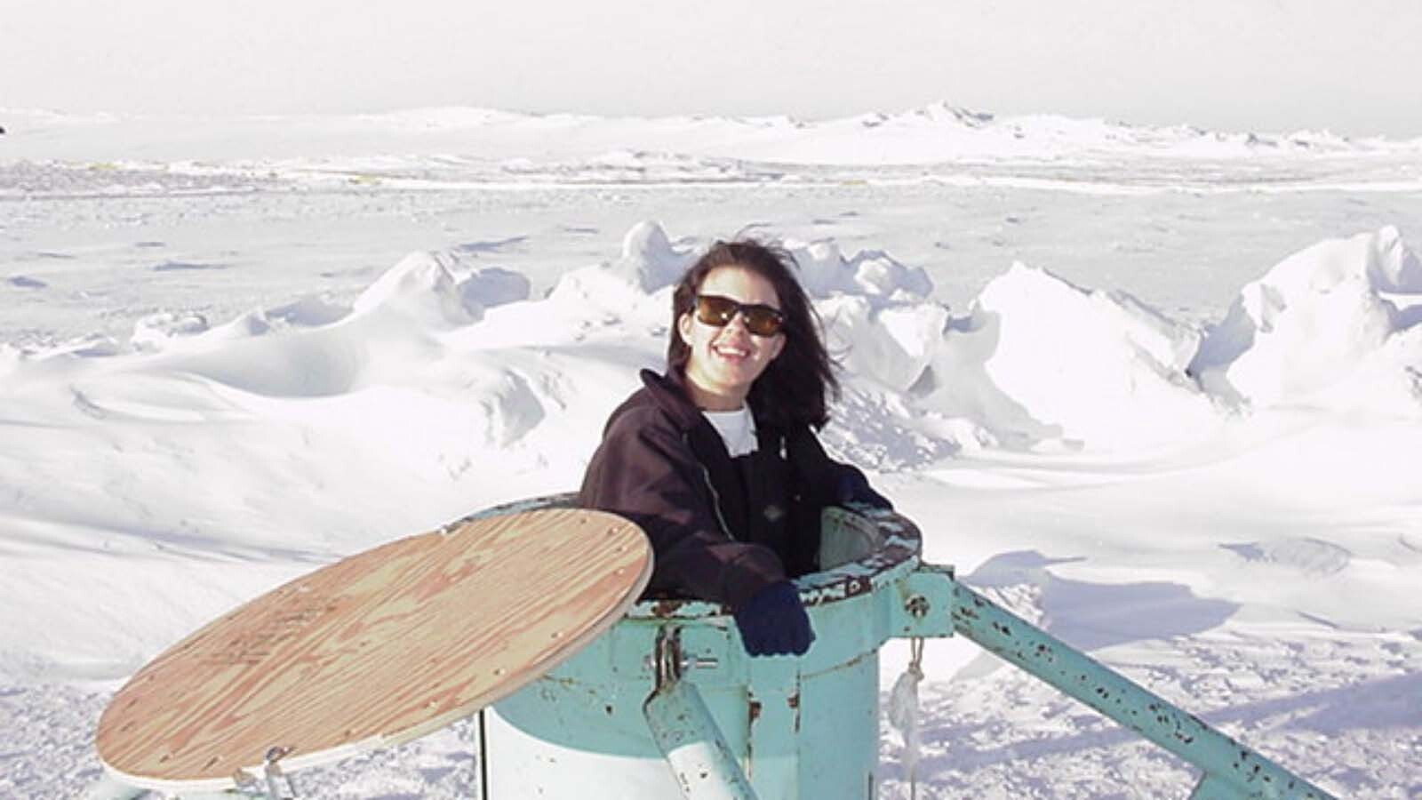 Deanna Werner cleaning windows in an underwater observation tube in Antarctica.