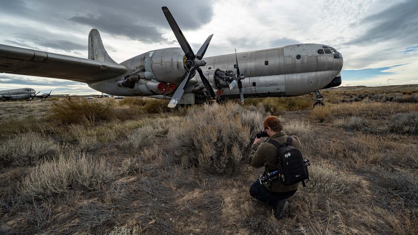 Freshmen and sophomore photography students from Northwest College in Powell, Wyoming, photograph the 11 vintage airplanes that were recently aucioned off in Greybull.