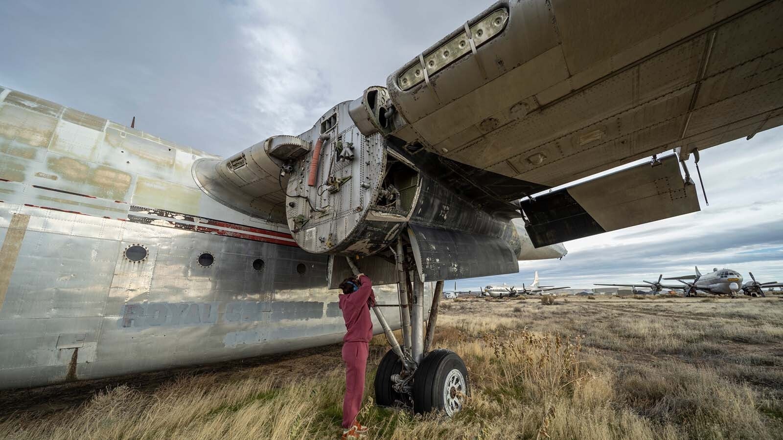 Freshmen and sophomore photography students from Northwest College in Powell, Wyoming, photograph the 11 vintage airplanes that were recently aucioned off in Greybull.