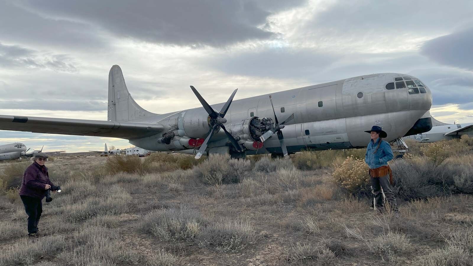 Freshmen and sophomore photography students from Northwest College in Powell, Wyoming, photograph the 11 vintage airplanes that were recently aucioned off in Greybull.