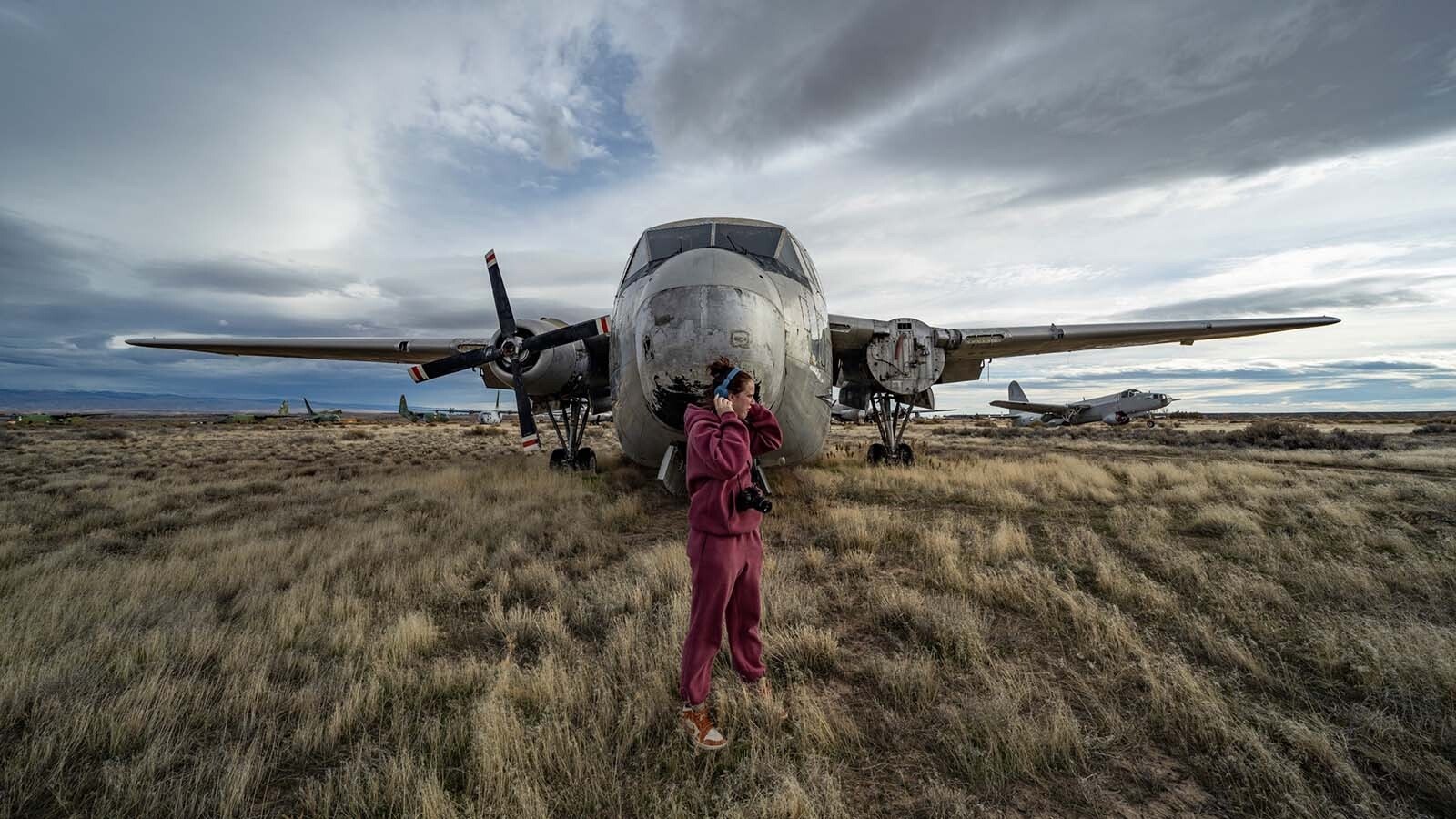 Freshmen and sophomore photography students from Northwest College in Powell, Wyoming, photograph the 11 vintage airplanes that were recently aucioned off in Greybull.