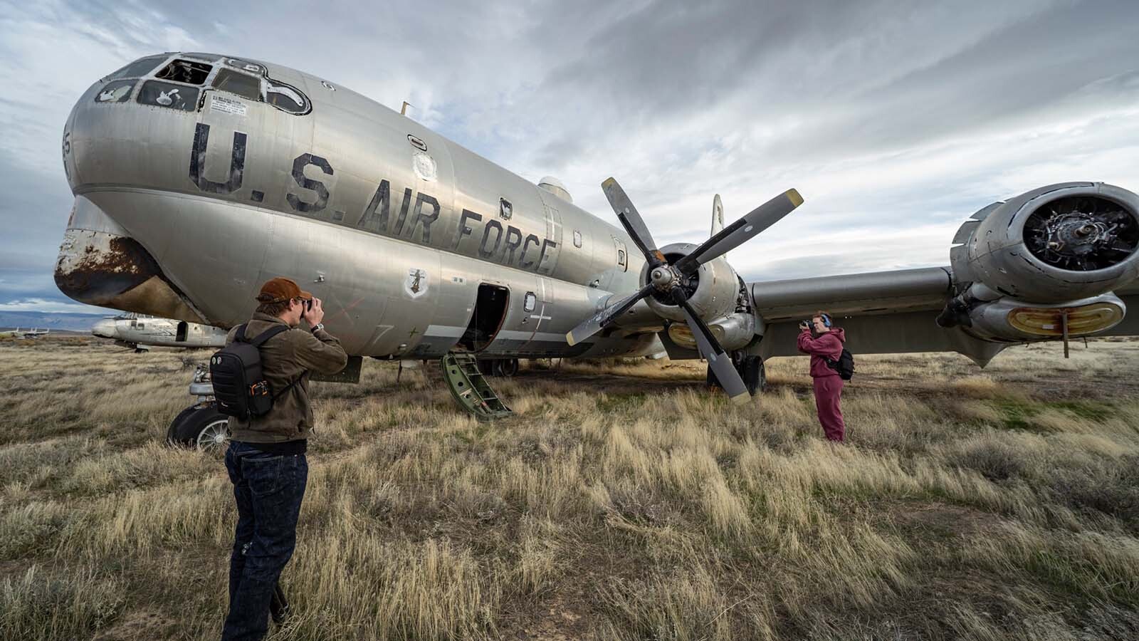 Freshmen and sophomore photography students from Northwest College in Powell, Wyoming, photograph the 11 vintage airplanes that were recently aucioned off in Greybull.