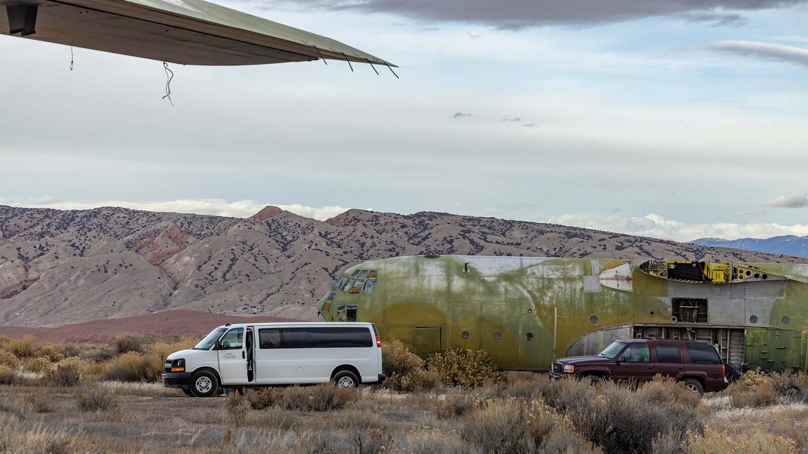 Freshmen and sophomore photography students from Northwest College in Powell, Wyoming, photograph the 11 vintage airplanes that were recently aucioned off in Greybull.