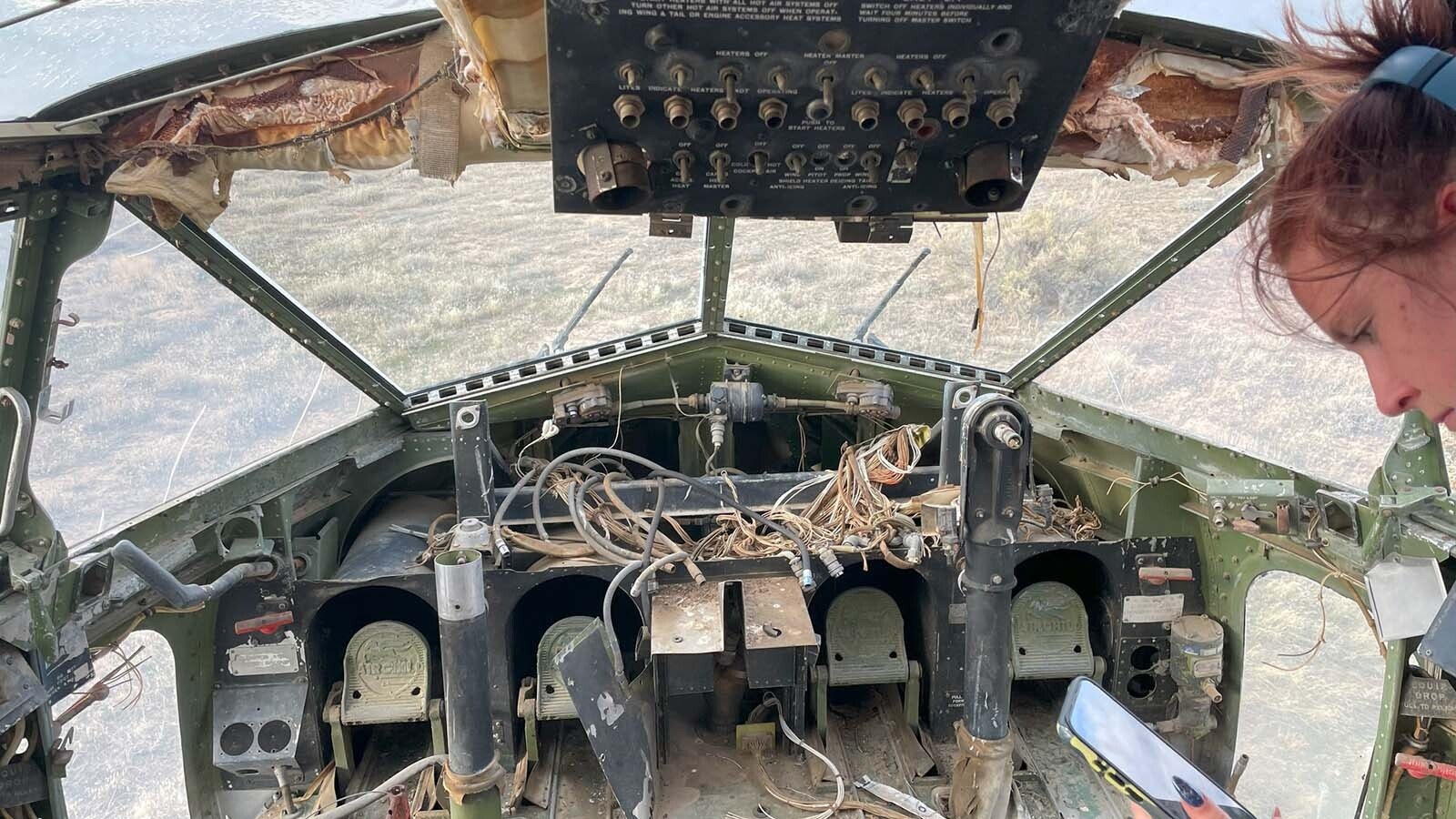 Freshmen and sophomore photography students from Northwest College in Powell, Wyoming, photograph the 11 vintage airplanes that were recently aucioned off in Greybull.