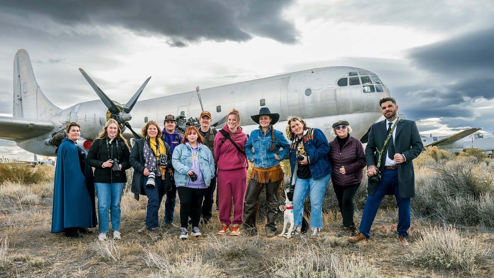 Freshmen and sophomore photography students from Northwest College in Powell, Wyoming, photograph the 11 vintage airplanes that were recently aucioned off in Greybull.