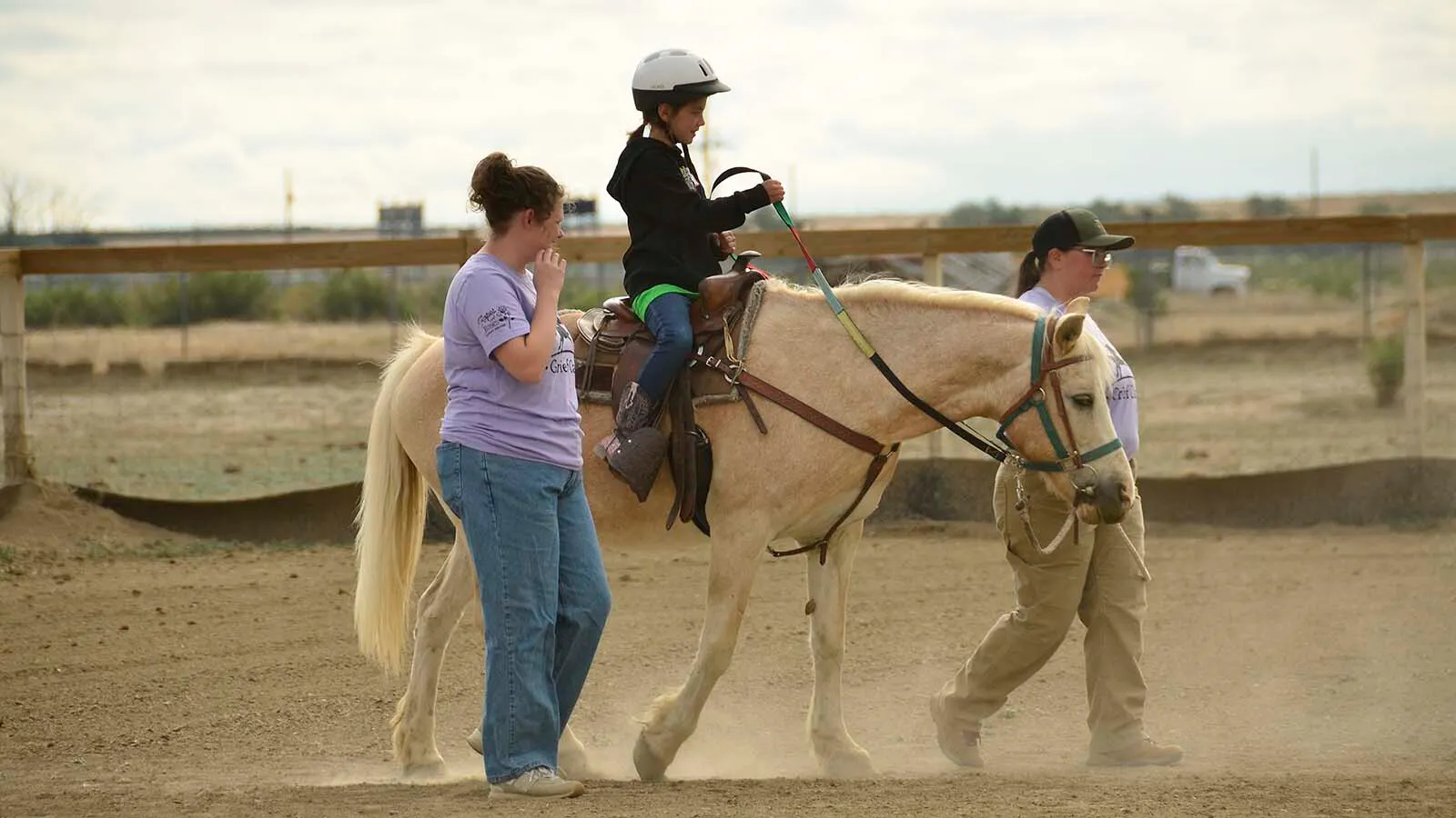 Eight-year-old Evelyn Waller rides a horse at Ropes & Roses grief camp near Casper
