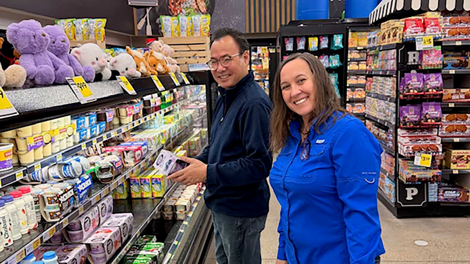 Susan Hale shops with Alvin Tolentino at Broulims Fresh Foods in Afton.