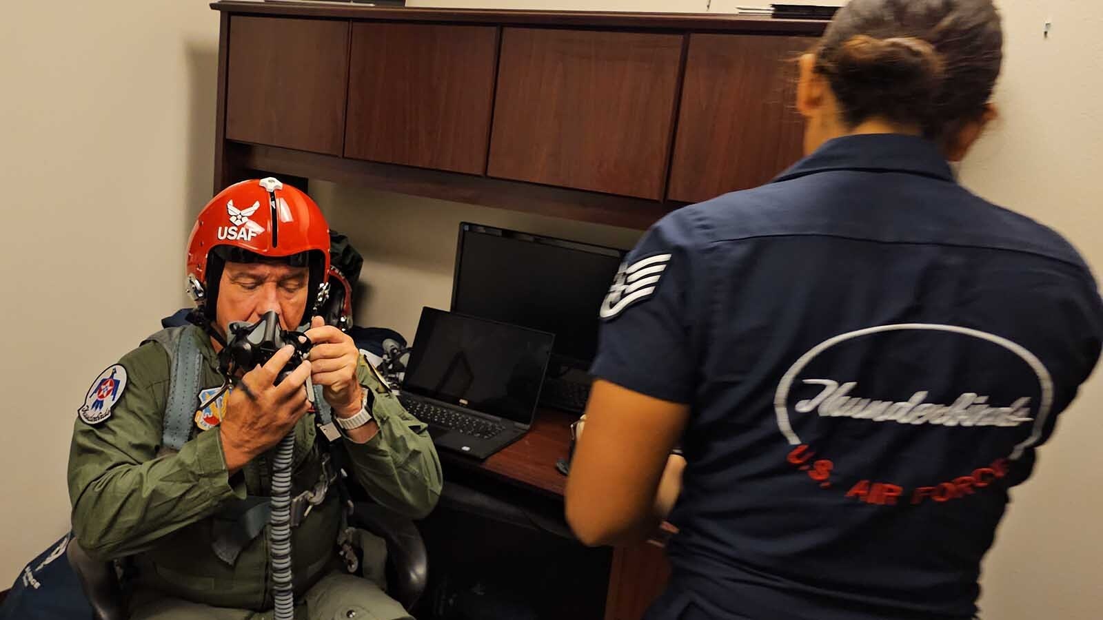 Brian "Alf" Grzegorczyk  learns how to operate the mask that goes with his helmet for his upcoming Hometown Hero Flight with the Thunderbirds.