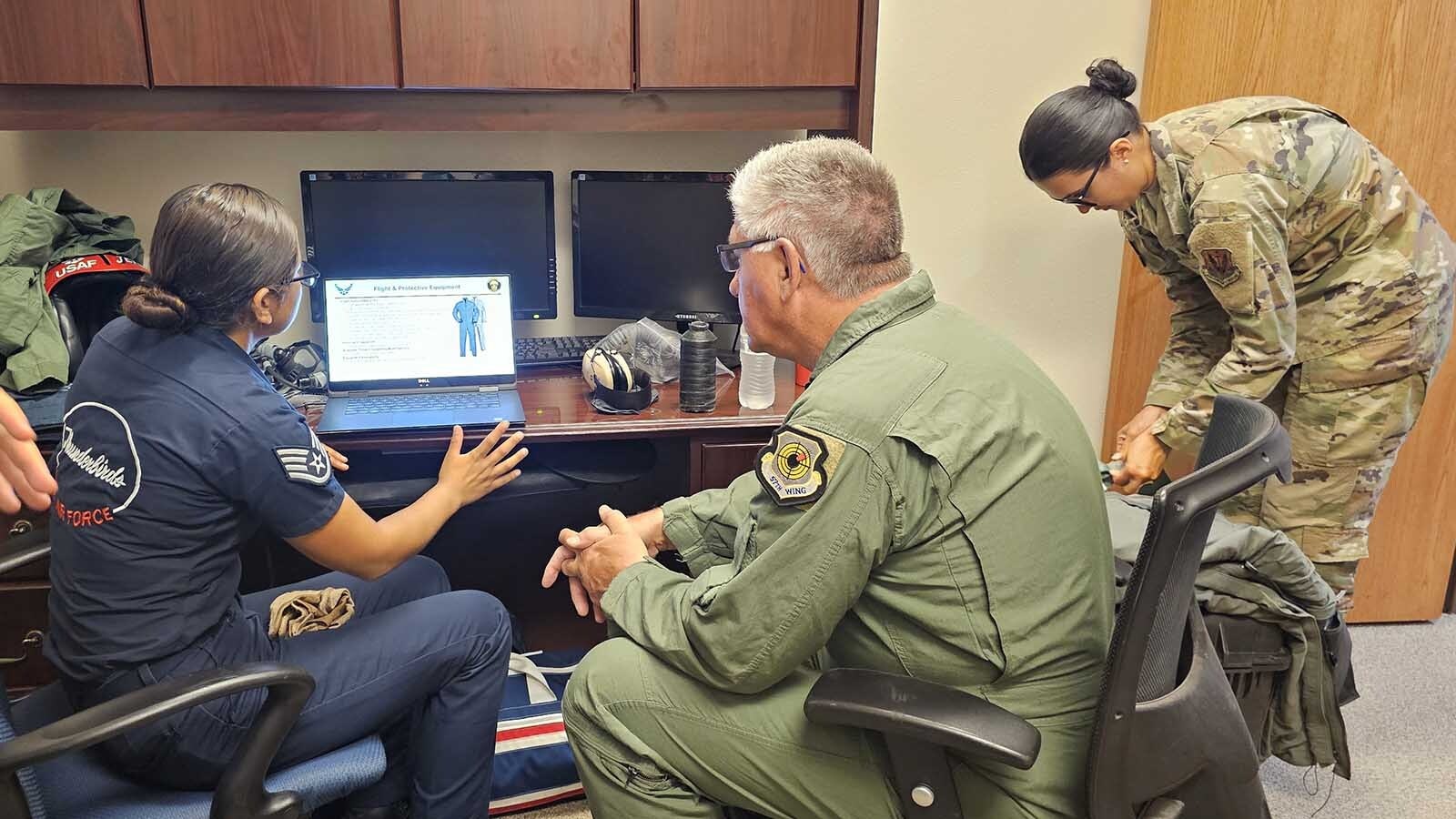 Brian "Alf" Grzegorczyk listens to the emergency procedures that he'll have to do aboard the Thunderbirds' F-16 Fighting Falcon, should anything happen to go wrong.