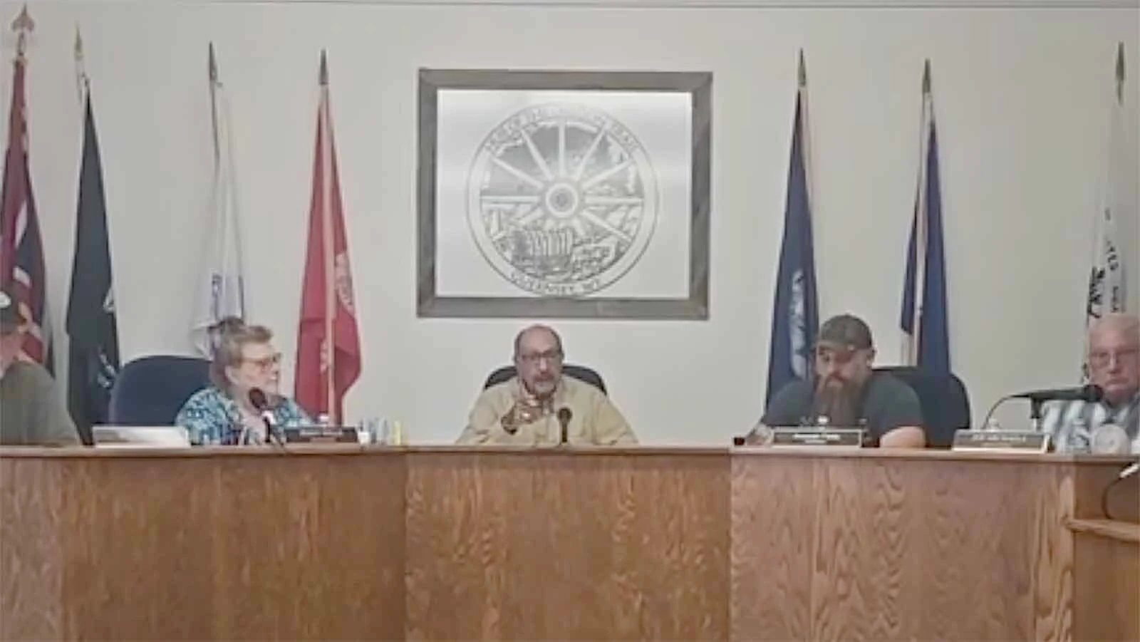 Guernsey Mayor Ed Delgado warns the daughter of a town council member about interrupting during the council's meeting Tuesday, April 21, 2026. He threatened to have her removed if she makes another outburst. Less than a minute later, she was removed for clapping.