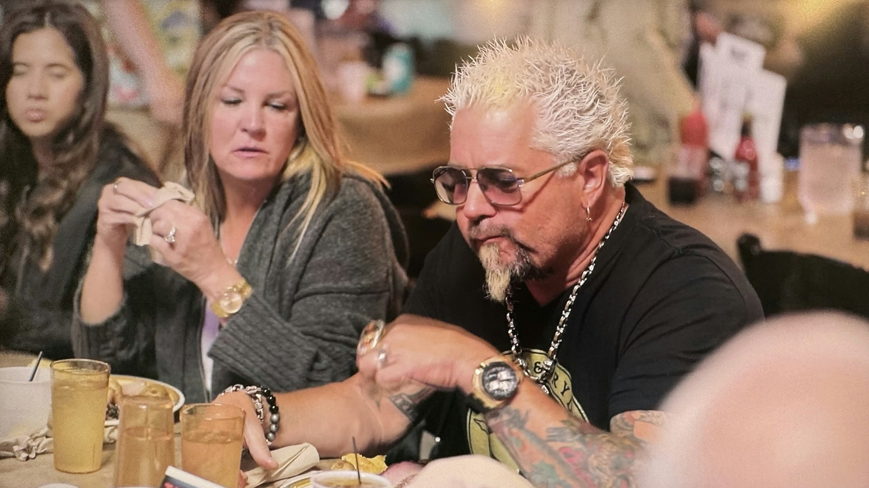 Guy Fieri enjoys a meal with hundreds of others at the Cody Cattle Company.