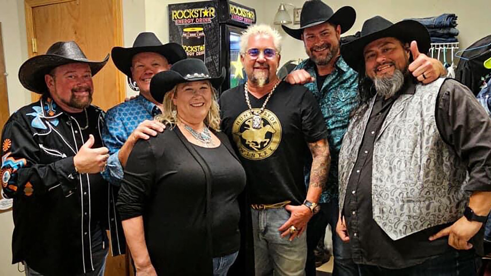 Guy Fieri with band Triple C Cowboys, from left, Marvin Short, Greg Pendley, Ann Pendley, Fieri, Ryan Martin and Johnny Sanchez.