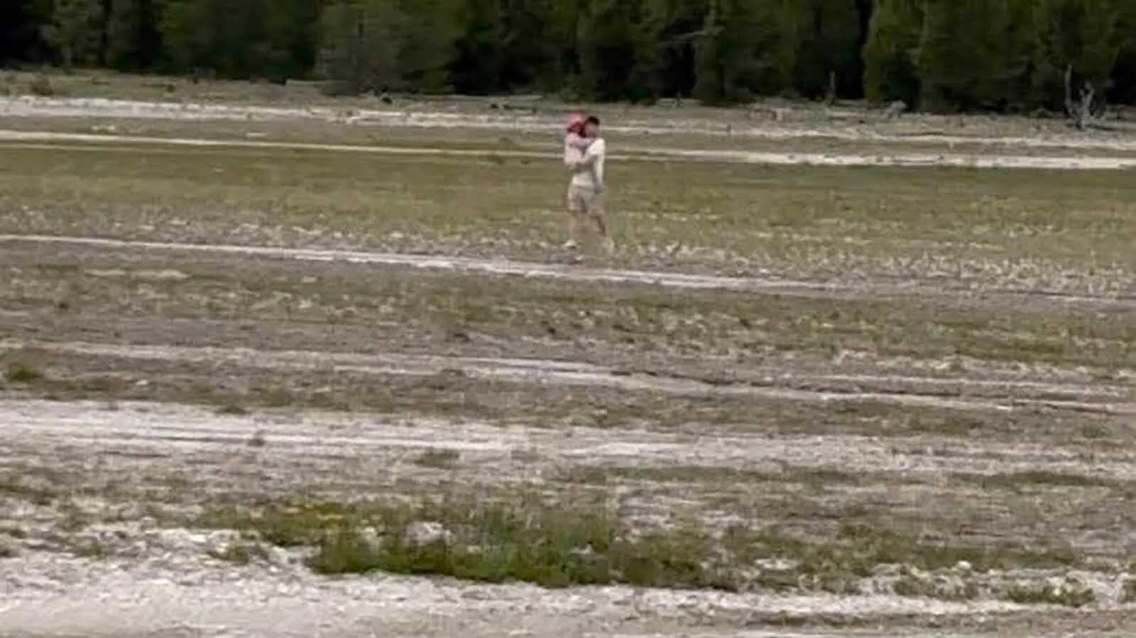 Yellowstone visitors near the popular Grand Prismatic Spring were outraged Sunday watching a man carry a child on dangerous thermals pools. "What the hell is wrong with people?” said a visitor who got a photo of the incident.