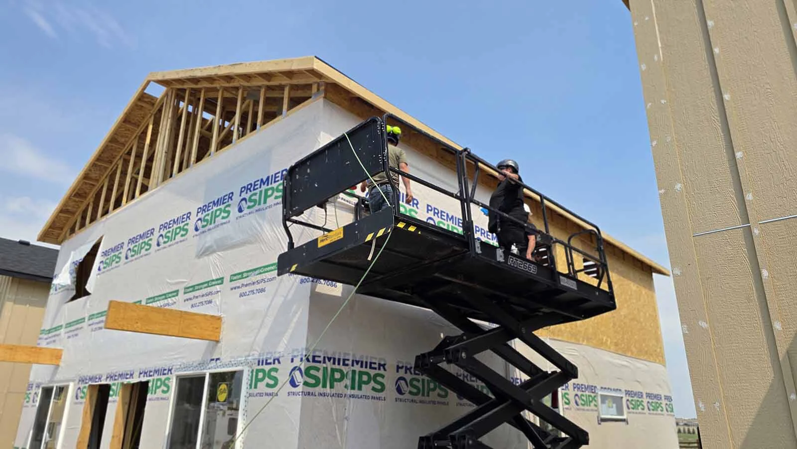 This home is being wrapped with a plastic covering that allows the final outdoor panels to seal better.