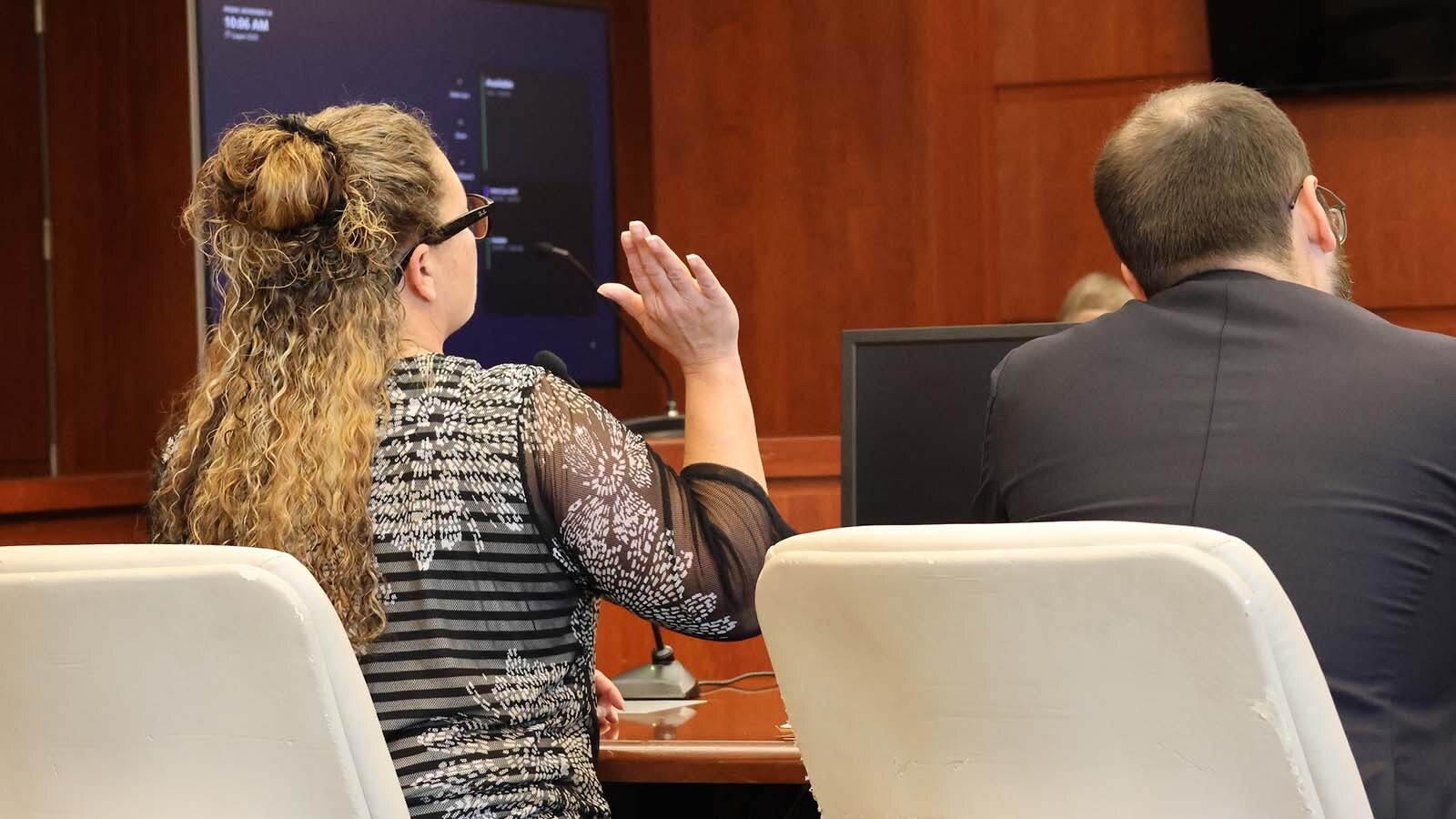 Becky Jo Hadlock raises her hands and swears to tell the truth in Casper Circuit Court on Friday.