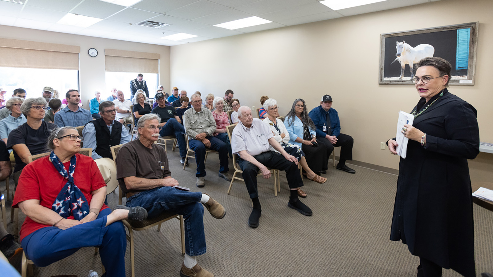 U.S. Rep. Harriet Hageman, R-Wyoming, talks to constituents in Saratoga, Wyoming, on June 28.