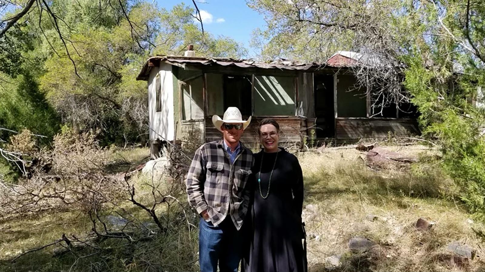 On right, U.S. Rep. Harriet Hageman, R-Wyoming, stands next to her nephew before the Pleasant Valley Fire burned her homestead home down. The home in background is where Hageman grew up as a young girl.