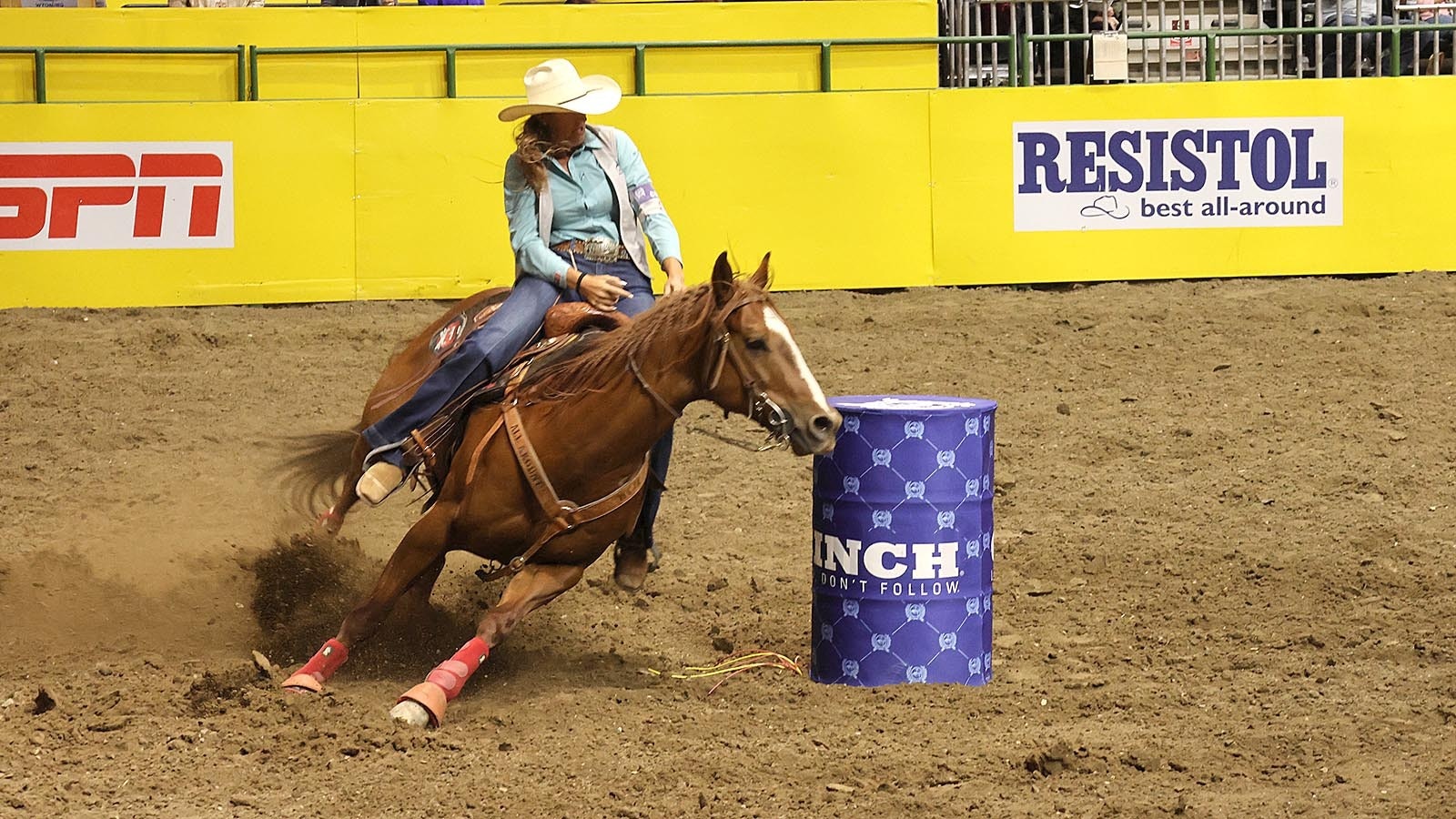 Haiden Thompson and Turbo tackle a barrel and send dirt flying during the barrel racing competition on Wednesday.
