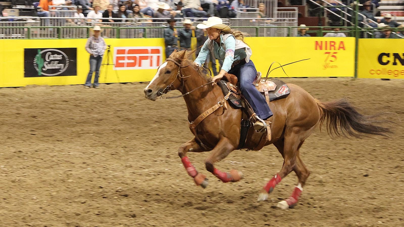 Gillette College’s Haiden Thompson flies into the arena on a horse named Turbo during barrel racing competition on Wednesday night.