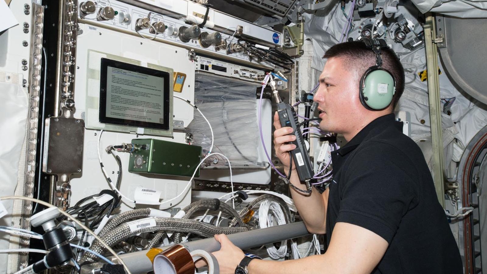 Astronaut Kjell Lingren communications with the ham radio set on the International Space Station.