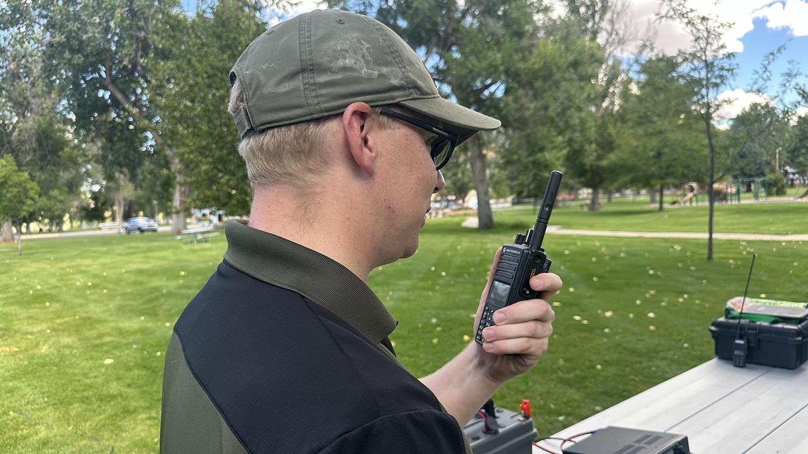 Ham operator Casey Freund demonstrates his handheld radio.