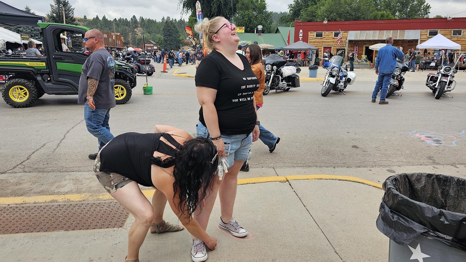 Cassie Goes marks footsteps into Rodeo Ron's Bar in the morning on Ham and Jam day, even as bikers start filtering into town.