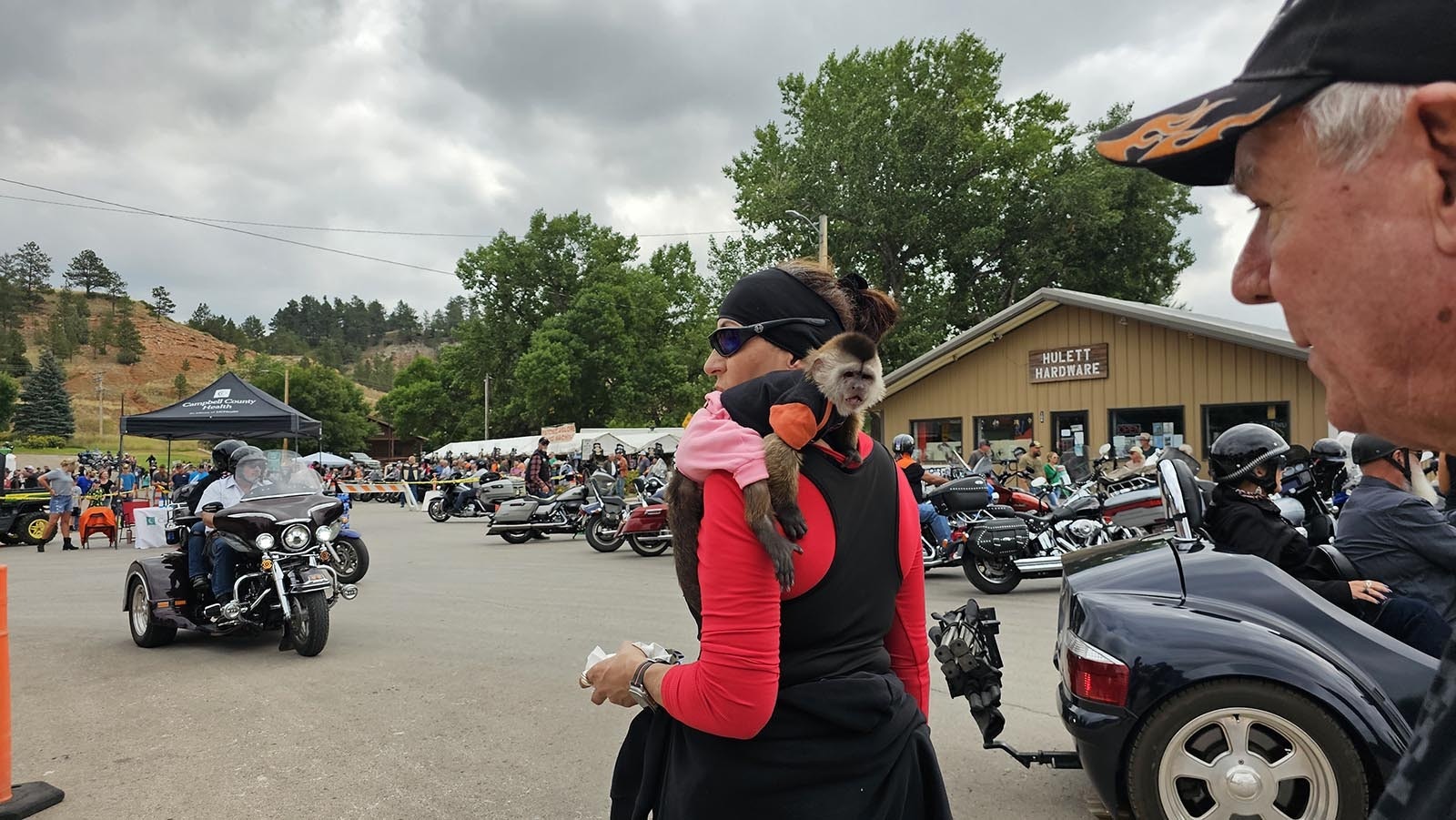 Cintia Foster with her pet monkey, Julie, walk around Hulett during the Ham and Jam.