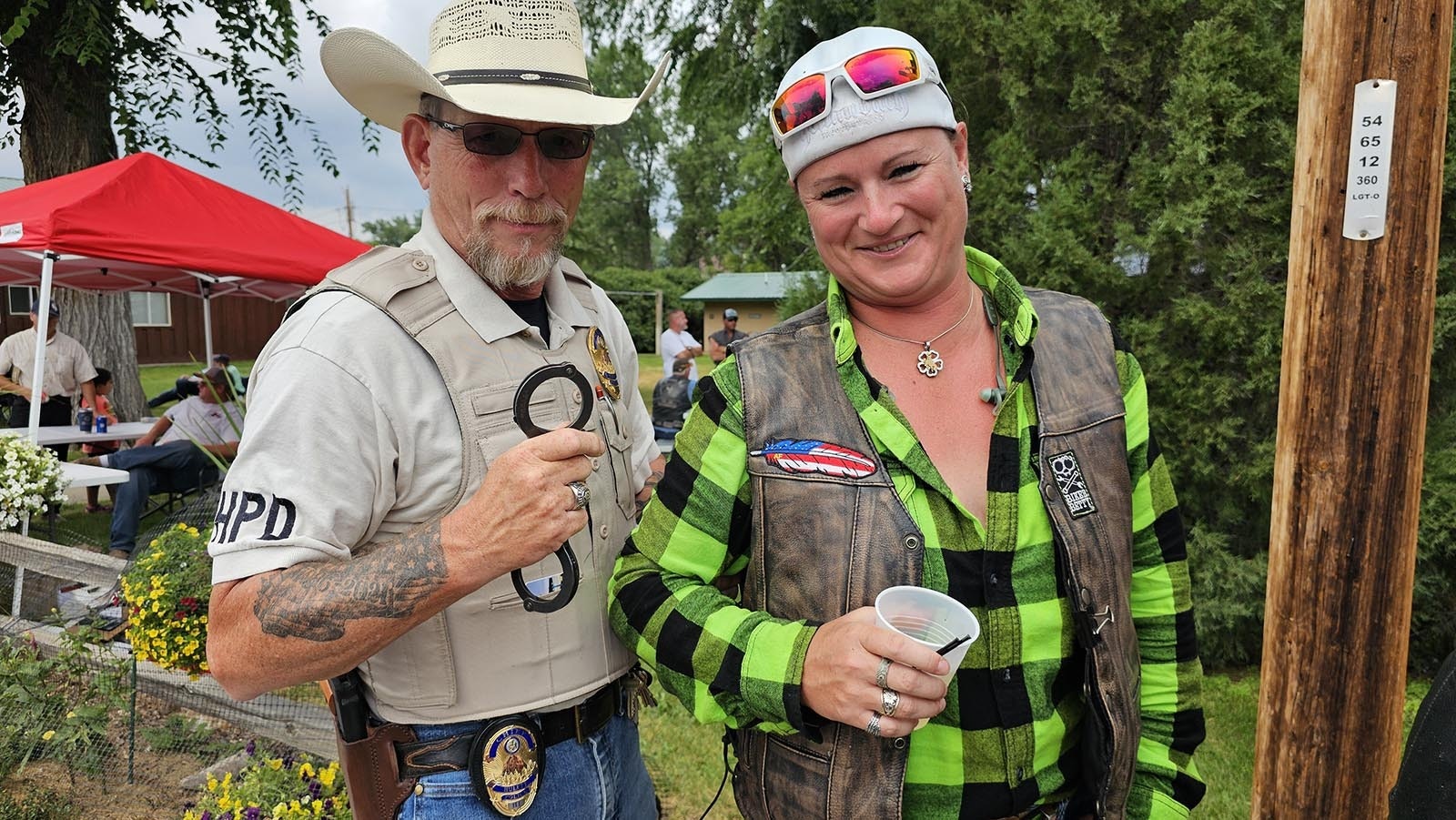 Police Chief Bill Motley has the handcuffs at the ready during Ham and Jam. But, he admits, most of his arrests are of the fake variety, for fun selfies with tourists.