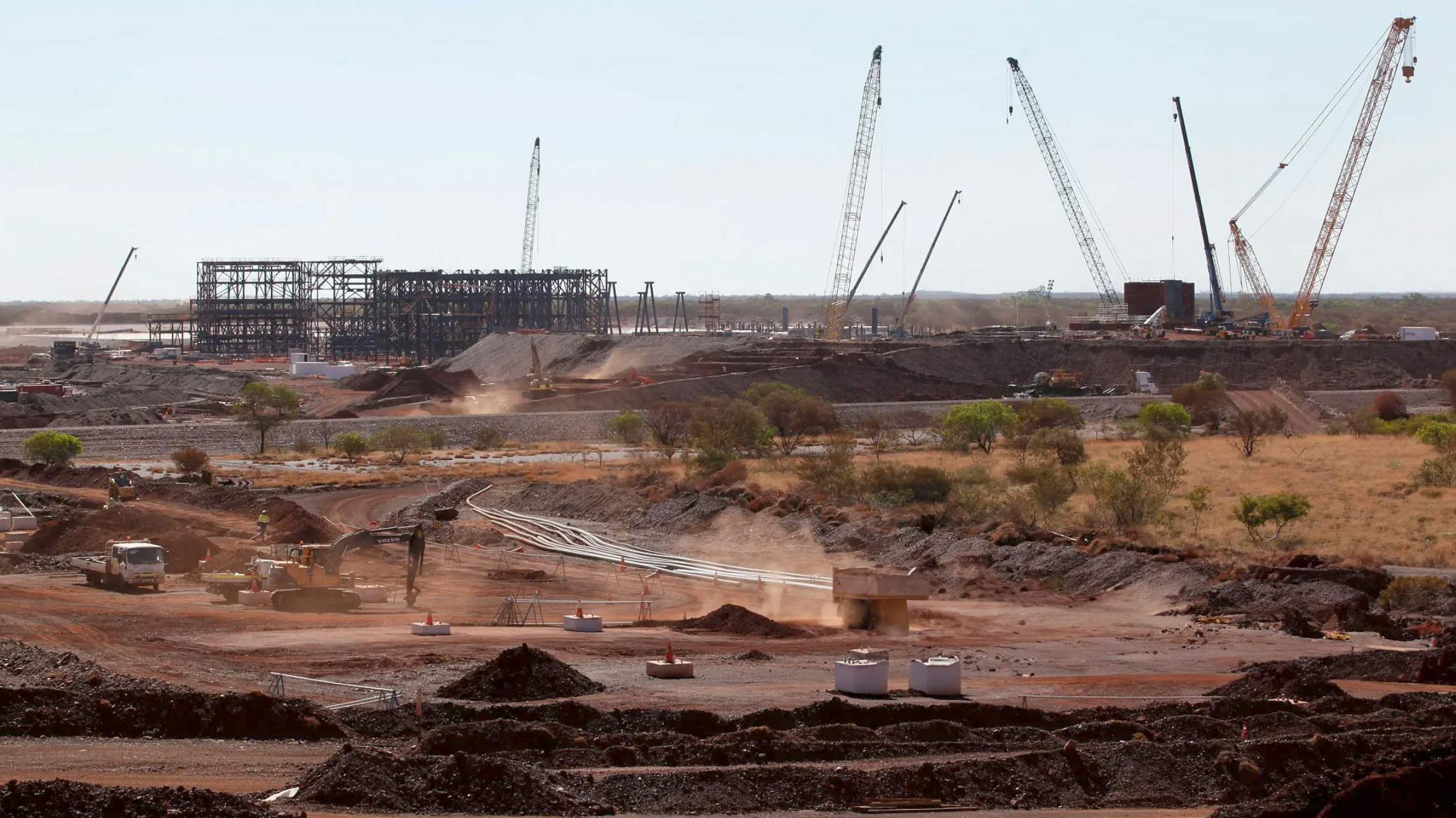 This file photo shows a truck driving through the mine process plant at Hancock Prospecting Ltd.'s Roy Hill Mine operations, under construction in the Pilbara region, western Australia, on Nov. 20, 2014.