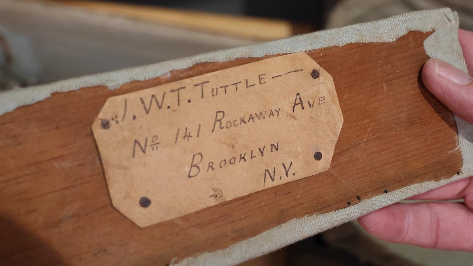 The 1870s guitar has the address of its owner in the string compartment of the case.