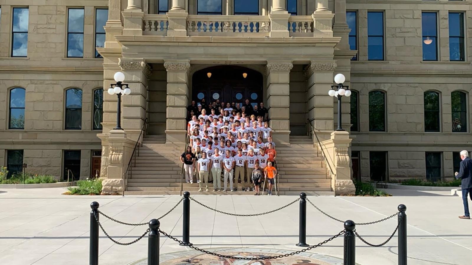 Members of the Mustangs pose outside the state Capitol during a tour.