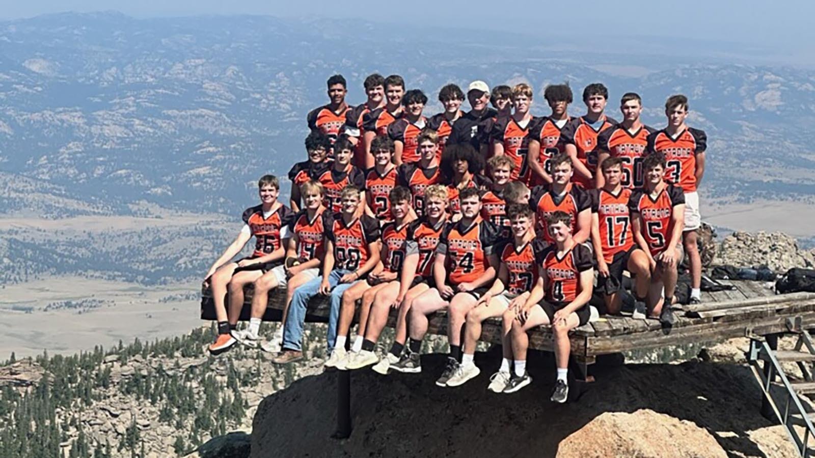 Seniors from the 2024 Mustangs pose on Laramie Peak with head coach Steve Harshman. Each year, Harshman organizes a senior retreat prior to the start of the season.