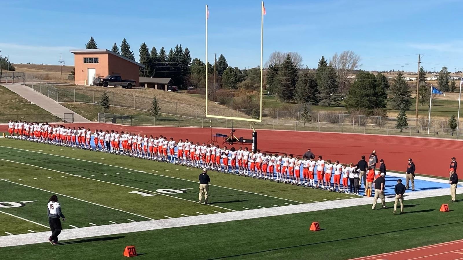 Natrona County High School players line up for the national anthem during a past season.