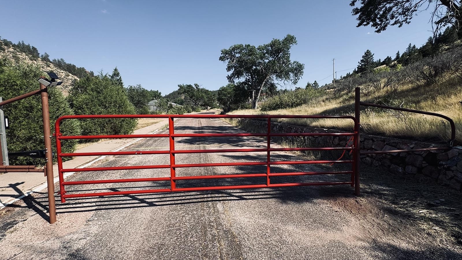 The town of mining town Sunrise is beyond the red gate.