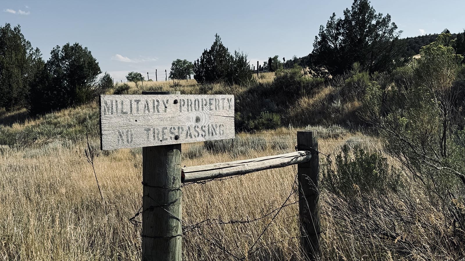 A no trespassing sign is posted at the bottom of a road leading to two cemeteries for Hartville.  One cemetery, called “Boot Hill,” has cowboy boots on posts surrounding the buried remains of local residents. The other, “Hartville Cemetery,” is where descendants from early miners from Italy, Greece and Lebanon are buried.