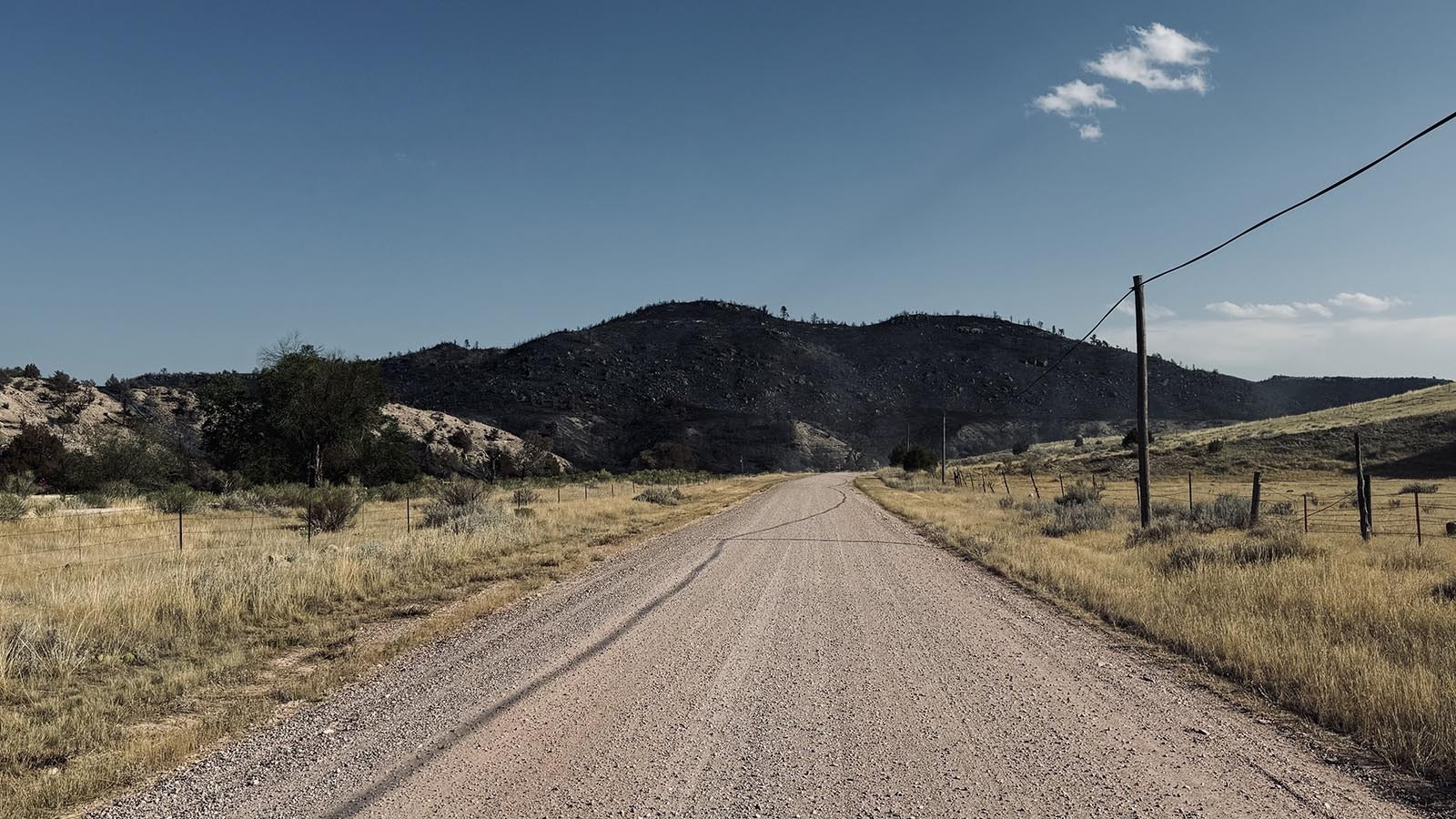 The burned hills resembled mountains of coal near the mouths of coal mines in Appalachia.