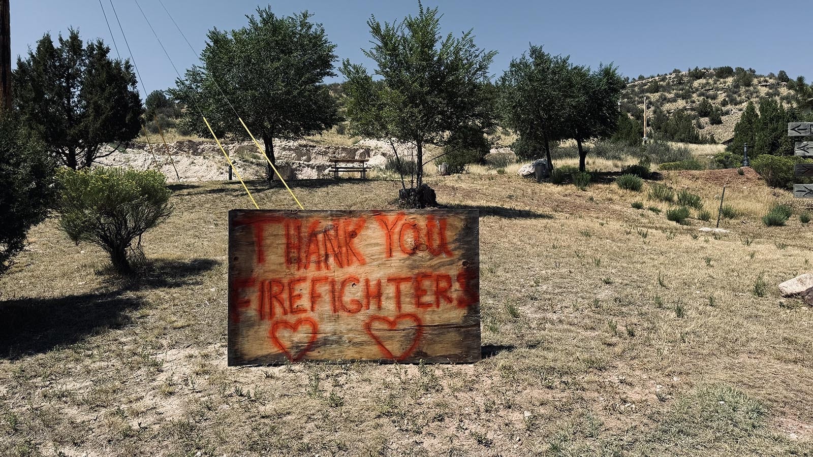 A sign has been posted at the entrance to Hartville that thanks the hundreds of firefighters who saved their town from destruction by the Pleasant Valley Fire.