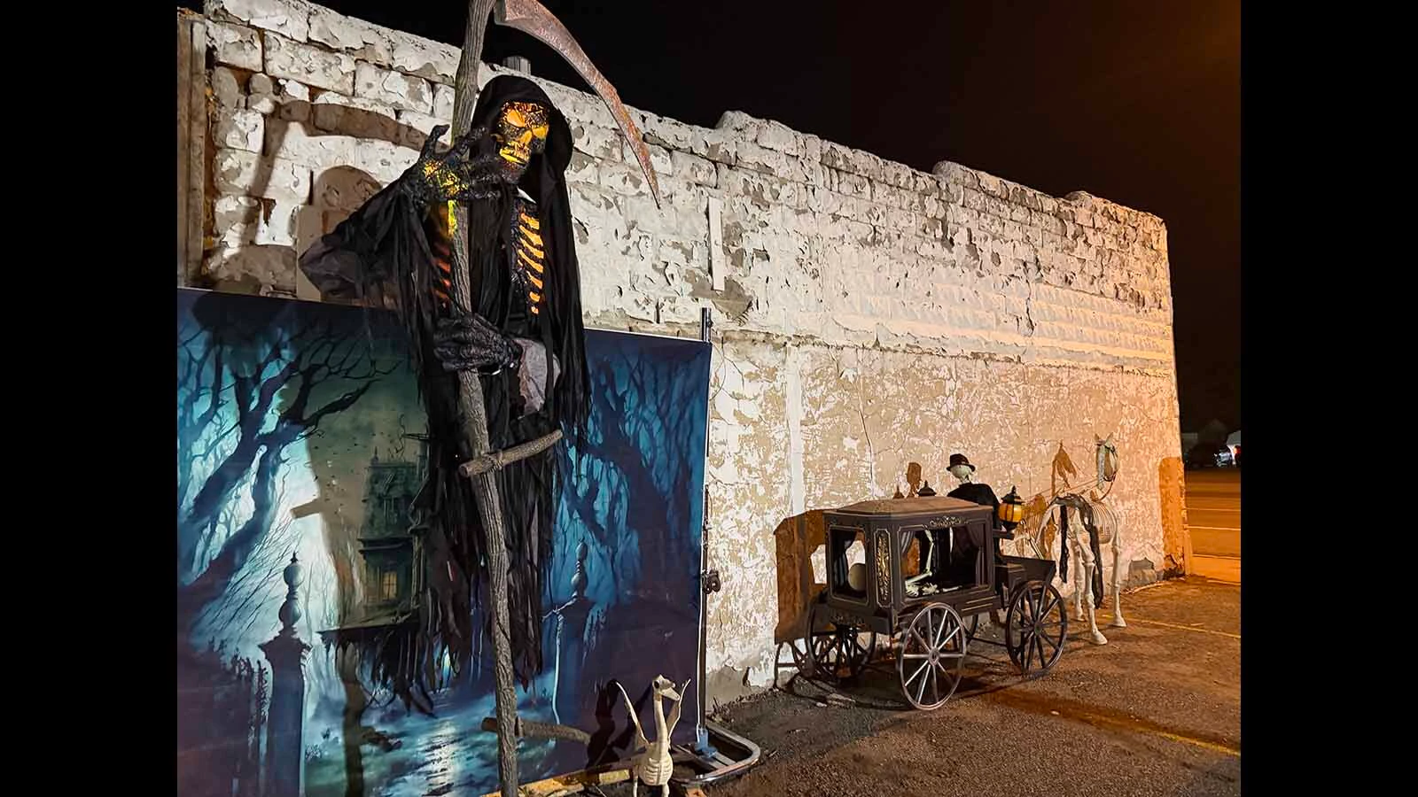 Visitors were greeted by the grim reaper and a skeleton horse at the Haunted House in Hudson. They are posed by the old Hudson bank that was almost next door to Gracies, a brothel, that has been converted into a haunted house for the past nine years. Over 2,000 people visited it this past weekend.