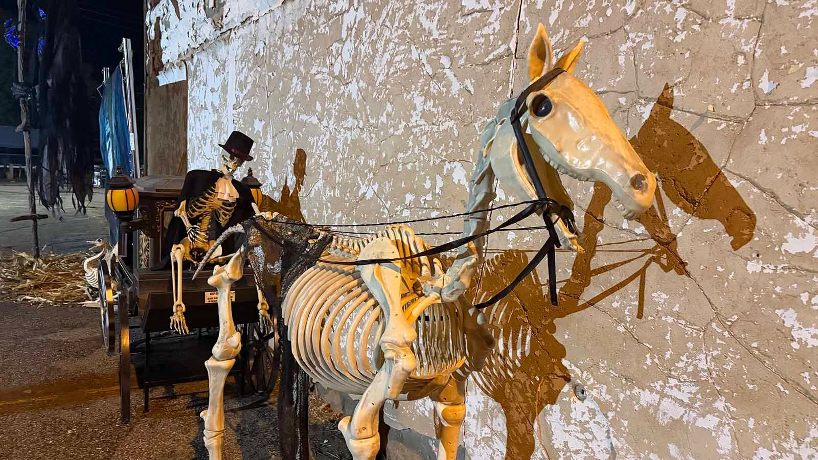 Visitors were greeted by the grim reaper and a skeleton horse at the Haunted House in Hudson. They are posed by the old Hudson bank that was almost next door to Gracies, a brothel, that has been converted into a haunted house for the past nine years. Over 2,000 people visited it this past weekend.