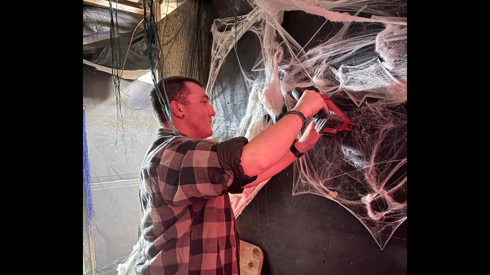 It takes an army of volunteers, like Titus Shenk, to put together the scary haunted house in Hudson. It helps when the haunted house is in a former brothel that is rumored to be haunted  by former occupants.