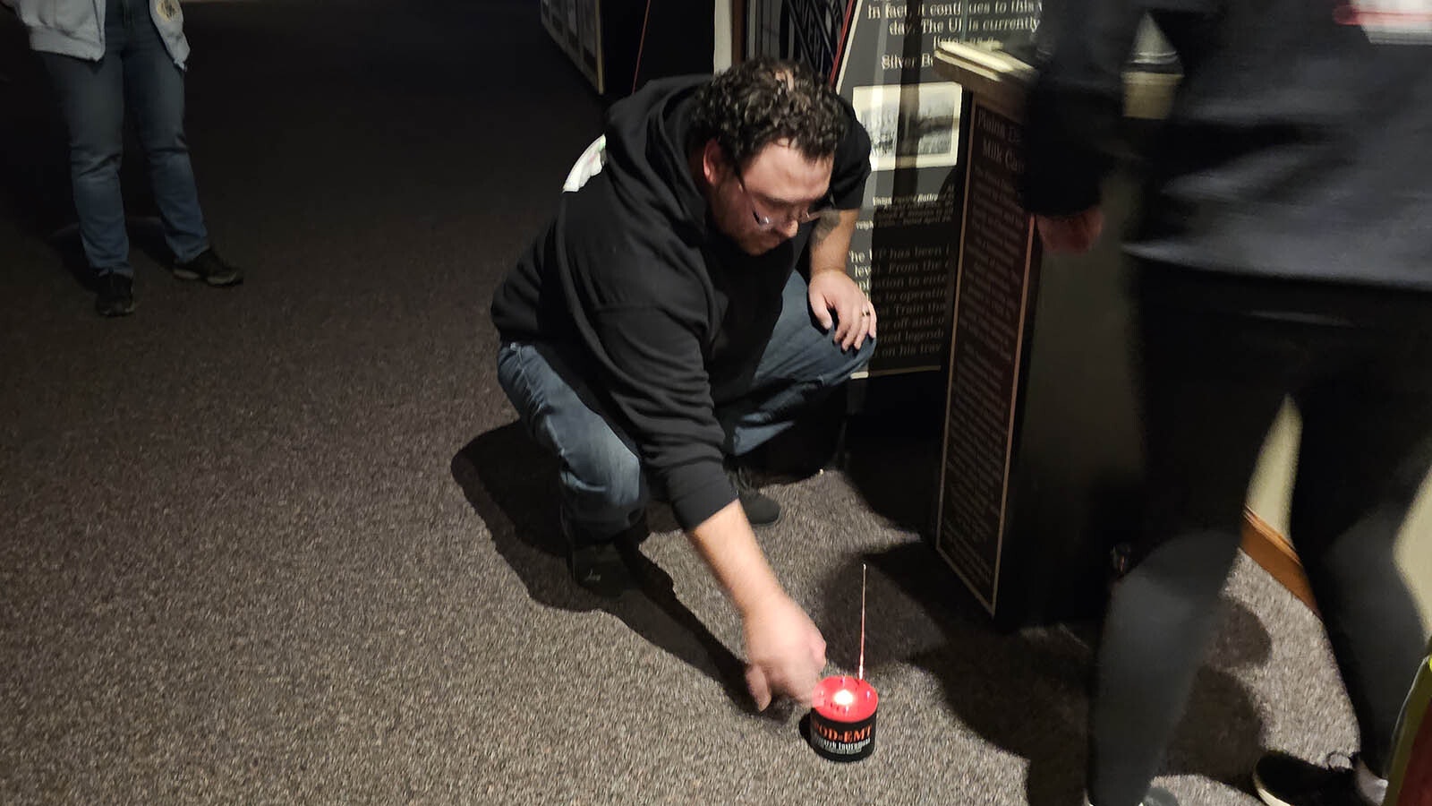 Marty Perez sets a REM pod up in an area where there is a milk jug at the CFD Old West Museum.