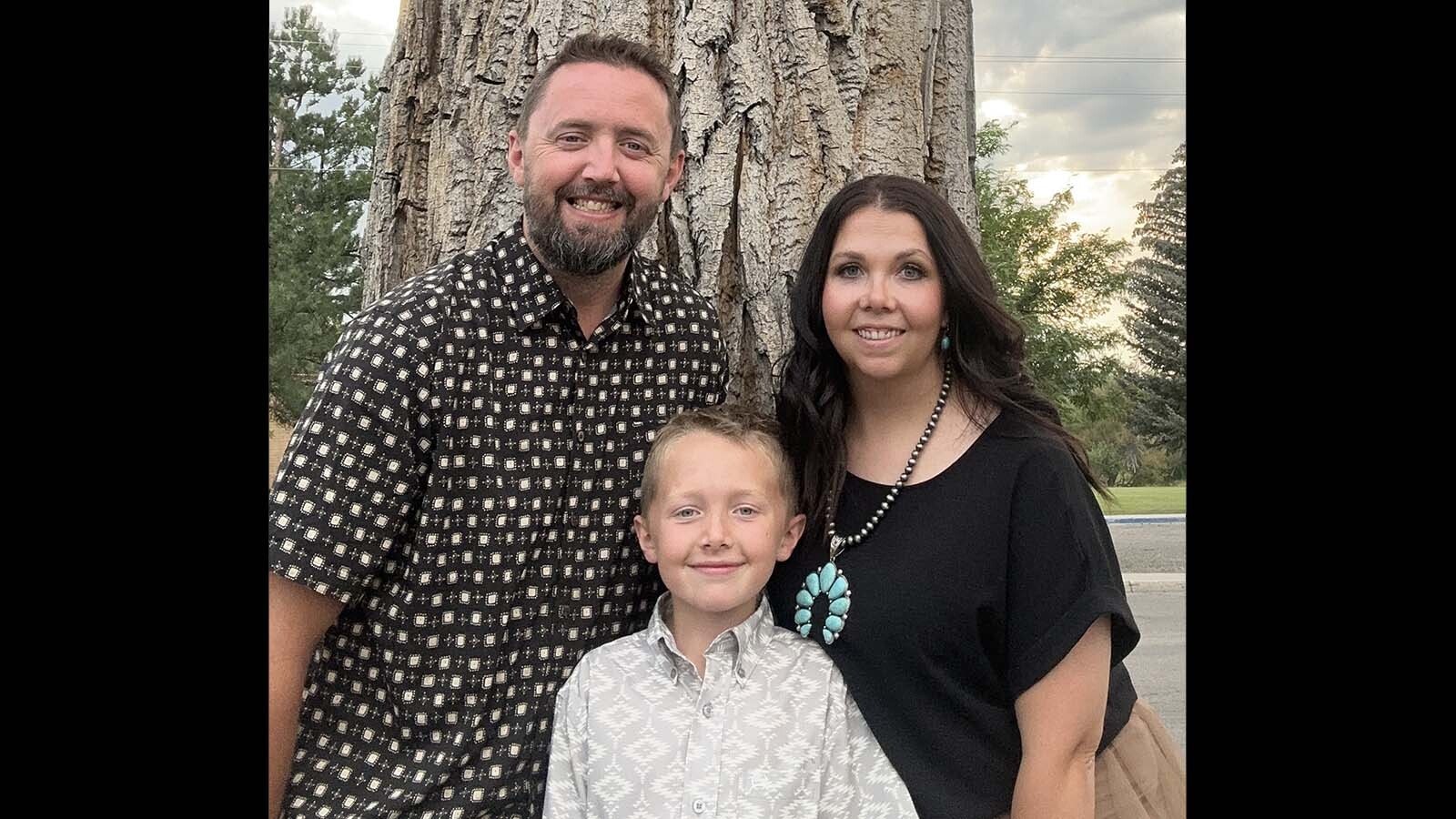 Haylee Reay Cole poses with her husband, James, and son.