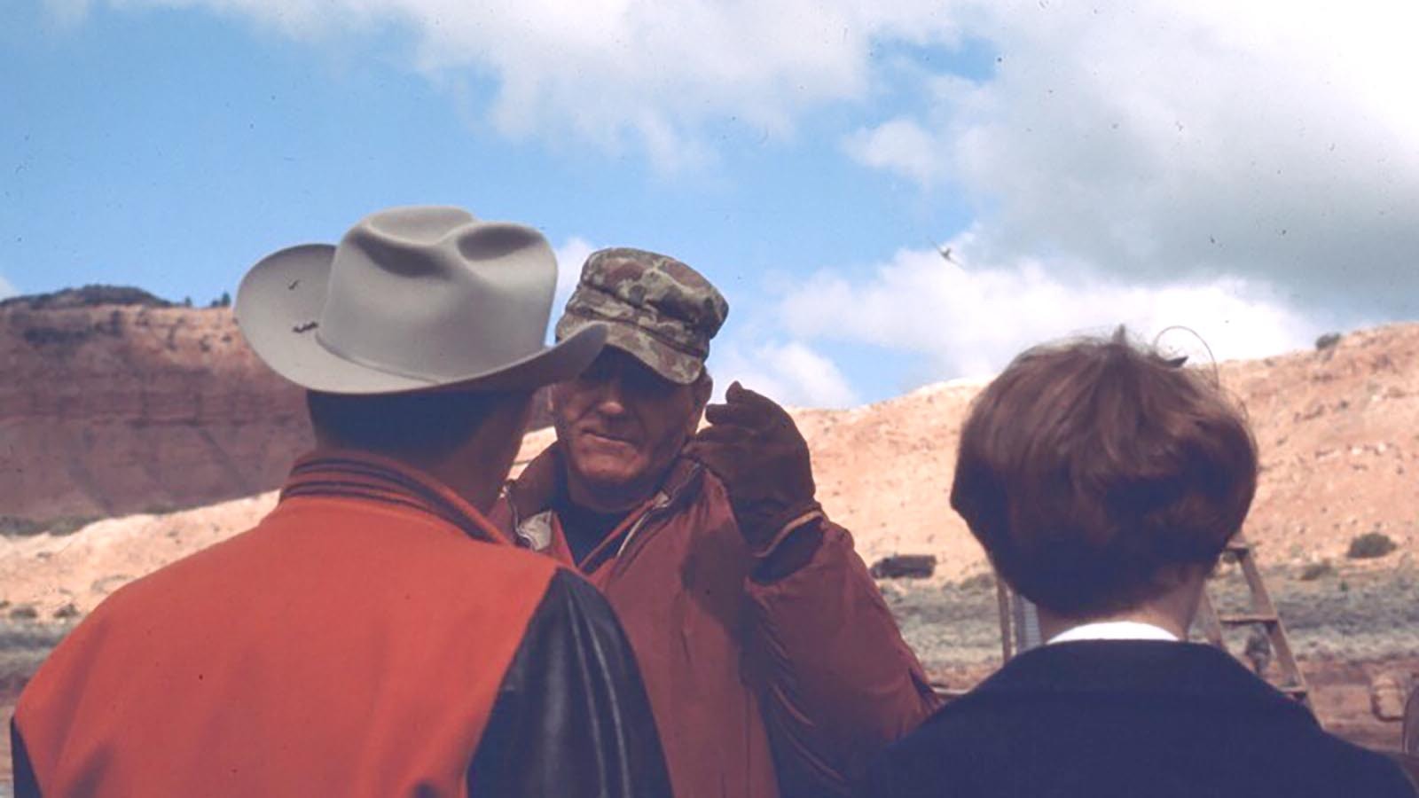 John Wayne listens during a conversation on the set for “Hellfighters” on the Speas Ranch southwest of Casper.