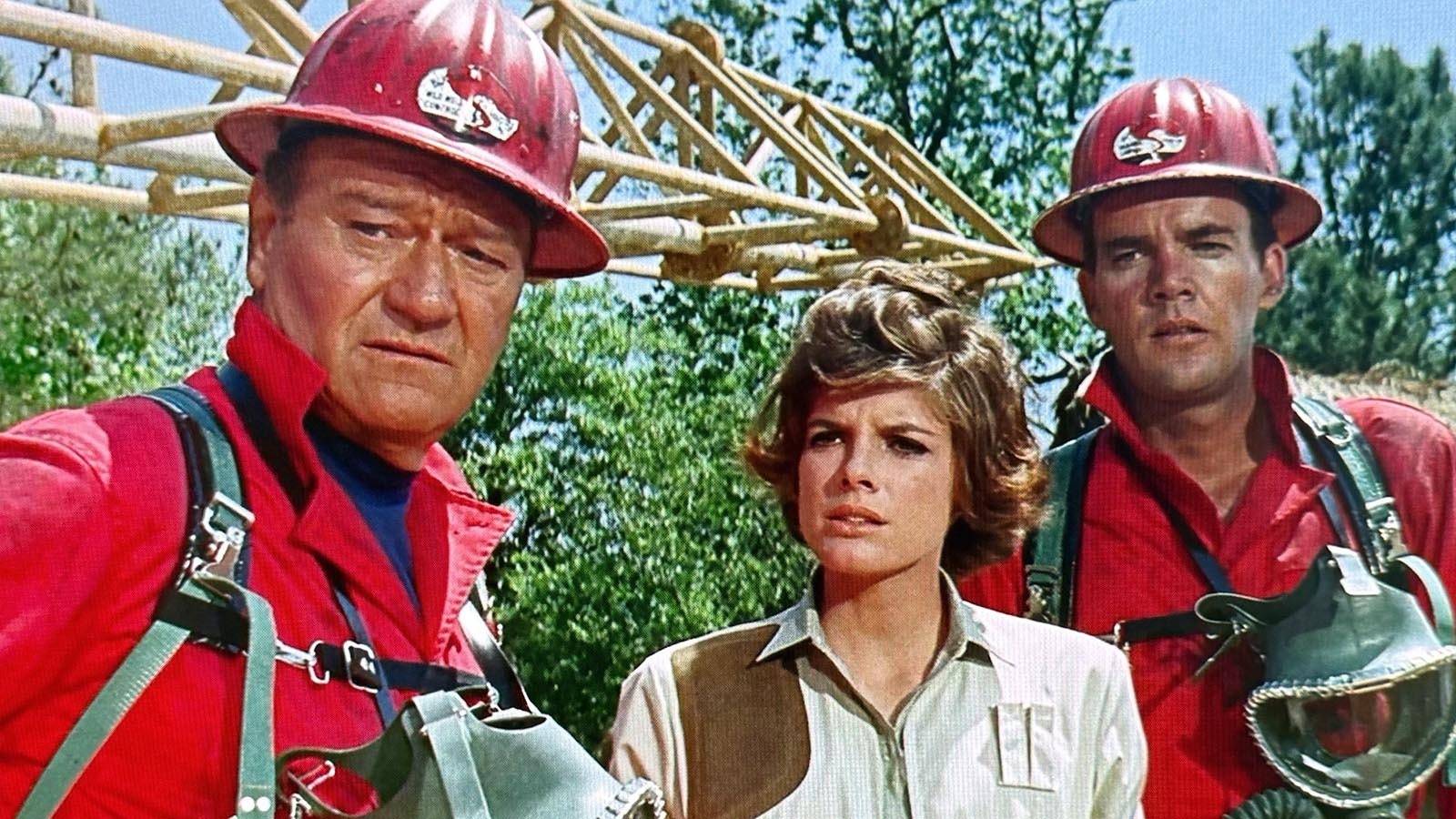 John Wayne, left, played the lead role of Chance Buckman in the 1968 Universal Pictures film "Hellfighters," which was partially shot near Casper, Wyoming. Also starring are Katherine Ross as Tish Buckman, center, and Jim Hutton and Greg Parker, right.