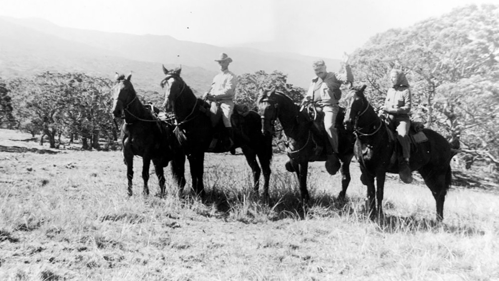 Ernest Hemingway, center, and Martha Gellhorn, right on horseback in Idaho in 1940.